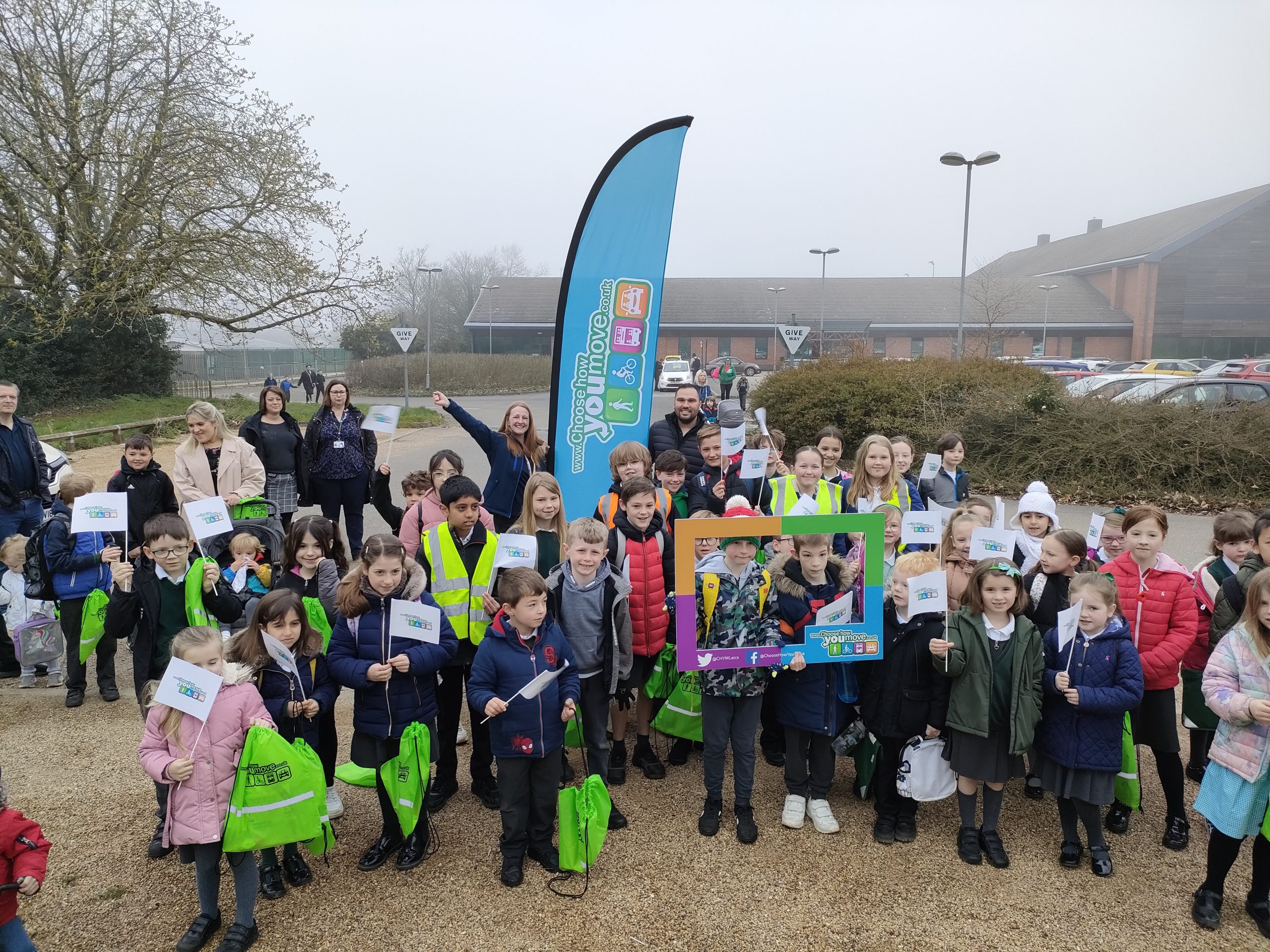 school children pose together in a group as they take part in park and stride